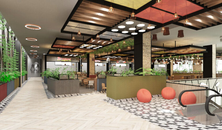 Imagen de pasillo con acceso a baños, rodeado de maceteros con plantas y luminarias circulares, junto a una vista general del área de food court con mesas, sillas y decoración moderna.