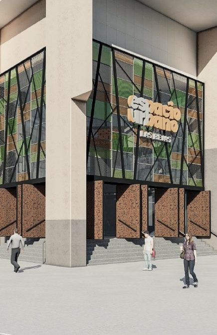 Vista exterior del centro comercial Espacio Urbano Las Rejas, destacando su fachada moderna con paneles de vidrio, detalles geométricos y acceso peatonal amplio, junto a logos de supermercados y tiendas anclas